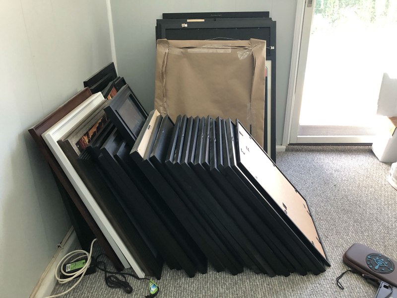 Just a small fraction of the frames waiting to find a new home in our new house.
